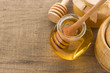 glass jar full of honey and stick glass jar full of honey and stick