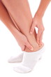 Young woman with an expression of severe pain in his leg