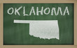 outline map of oklahoma on blackboard
