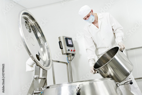 Photo: pharmaceutical factory worker pharmaceutical factory worker