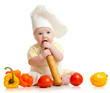 Portrait of a baby wearing a chef hat with healthy  food vegetab