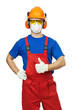 builder in hardhat, earmuffs, goggles and gas mask