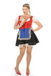 Blonde junge Frau im Dirndl mit Lebkuchenherz