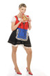 Blonde junge Frau im Dirndl mit Lebkuchenherz