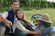 Couple drinking wine in a vineyard
