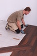 Man laying laminate flooring