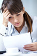 young woman reading a letter and sorrow