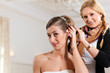 Stylist pinning up a bride's hairstyle Stylist pinning up a bride's hairstyle