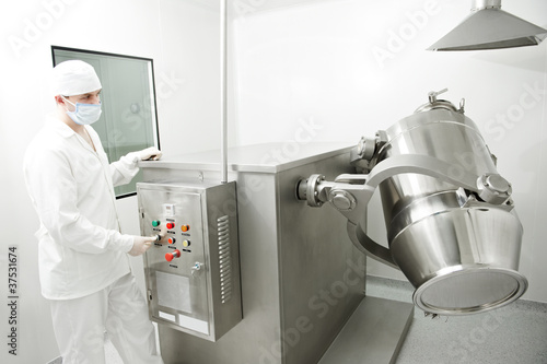 Photo: pharmaceutical factory worker pharmaceutical factory worker