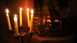 Fireless fireplace with candles near.