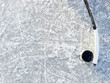 Hockey stick and puck on ice