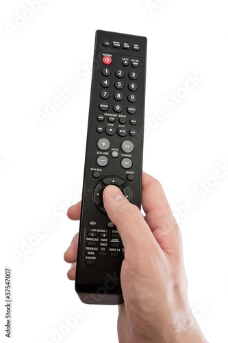 Photo: The TV remote control in hand. isolated The TV remote control in hand. isolated