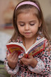 Girl looking at book