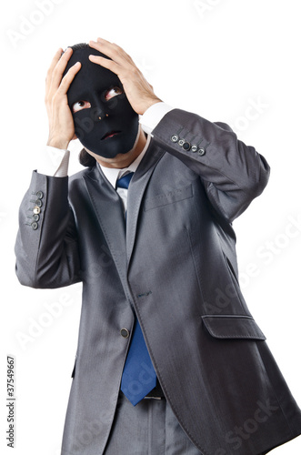Photo: Industrial espionage concept with masked businessman Industrial espionage concept with masked businessman