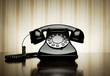 Vintage telephone over striped wallpaper