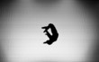 silhouette of female gymnast on trampoline silhouette of female gymnast on trampoline