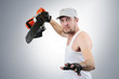 Crazy man with the electric saw in the pose of a fighter