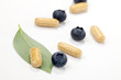 Photo: Bilberry pills and berries Bilberry pills and berries