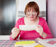 Sad woman with utility bills Sad woman with utility bills