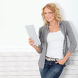 Beautiful modern woman using digital tablet