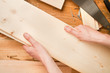 Man's hands holding planks