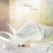 Wedding invitation card with calla lilies and golden rings