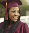 Woman wearing graduation cap and gown