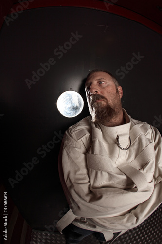 Photo: Man in a straitjacket Man in a straitjacket