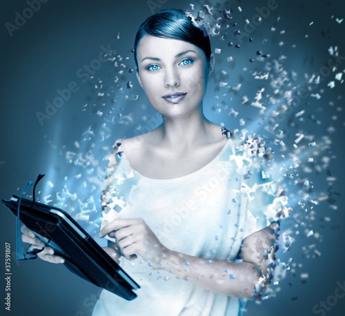 Photo: Poster photo of young pretty woman using her tablet computer and Poster photo of young pretty woman using her tablet computer and
