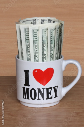 American Dollars - 100 USD Bills In Mug - Stock Pictures Photos