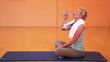 Woman in gym drinking water