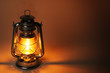 Photo: Burning kerosene lamp in dark, concept lighting Burning kerosene lamp in dark, concept lighting