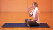 Thirsty woman drinking water in gym