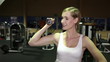 Woman using dumbbells in gym