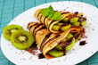 Kiwi crepes with chocolate sauce