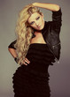 studio portrait og young sexy blond woman