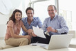 Couple sitting on sofa with financial advisor