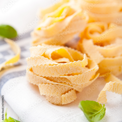 Photo: Italian egg pasta on kitchen towel Italian egg pasta on kitchen towel