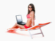 Photo: Girl with laptop on sunbed Girl with laptop on sunbed