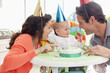 Parents and baby celebrating first birthday