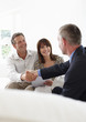 Financial advisor shaking hands with customers