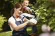 Couple gardening together in backyard