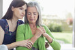 Photo: Woman consoling sad mother Woman consoling sad mother