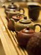 teapots on a bamboo teaboard