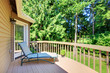 Photo: Balcony with summer back yard with pine trees Balcony with summer back yard with pine trees