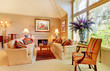 Photo: Elegant luxury living room with fireplace and large window. Elegant luxury living room with fireplace and large window.