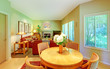Photo: Large living room with breakfast table near kitchen. Large living room with breakfast table near kitchen.