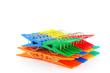 Color clothes-pegs over white