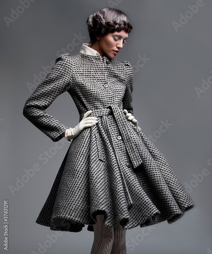 Photo: Fashion model in retro apparel Fashion model in retro apparel
