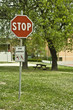 Stop traffic sign in a green meadow